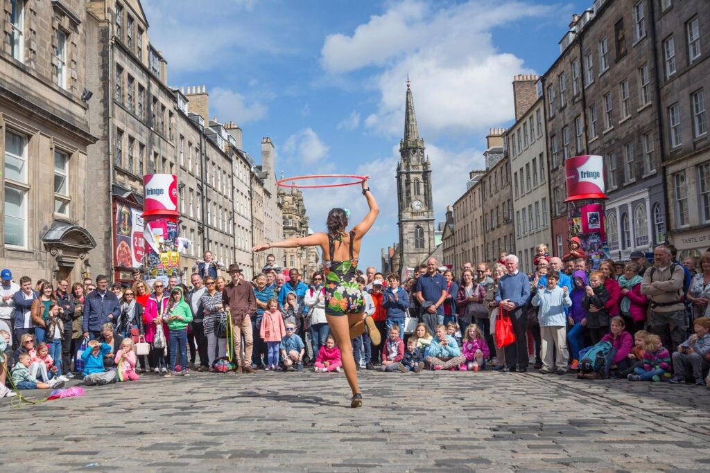 Picture of a girl playing a hoola hoop during the Edinburgh Festival Fringe in Scottland 