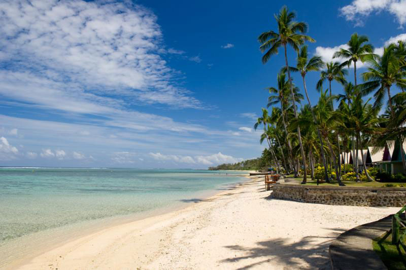 Beautiful sunny day on the beach of the Coral Coast. There are cirrus clouds in the sky.