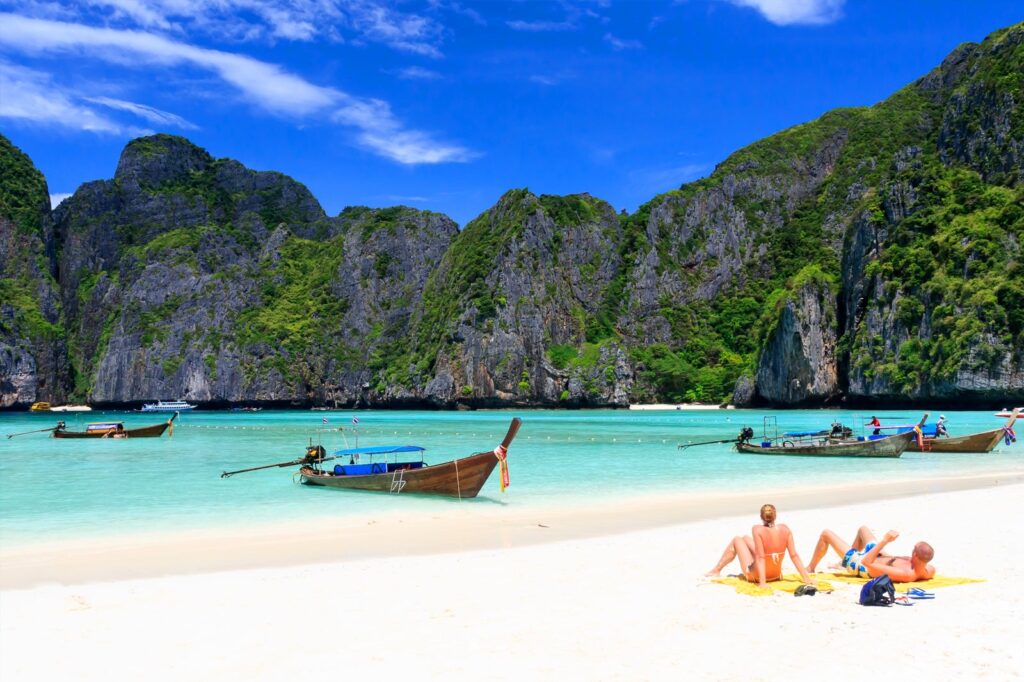 Picture of a beautiful day on the Maya Beach in Thailand. People basking in the sun.