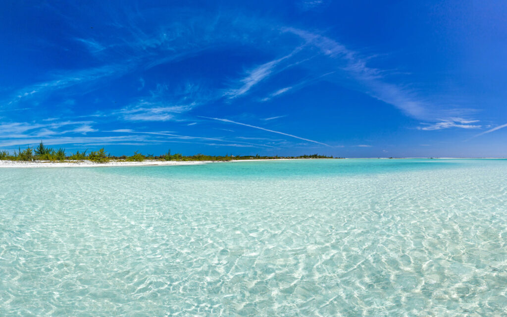 A picture of clean sparkling water in Playa Paraiso with the blue sky in the background